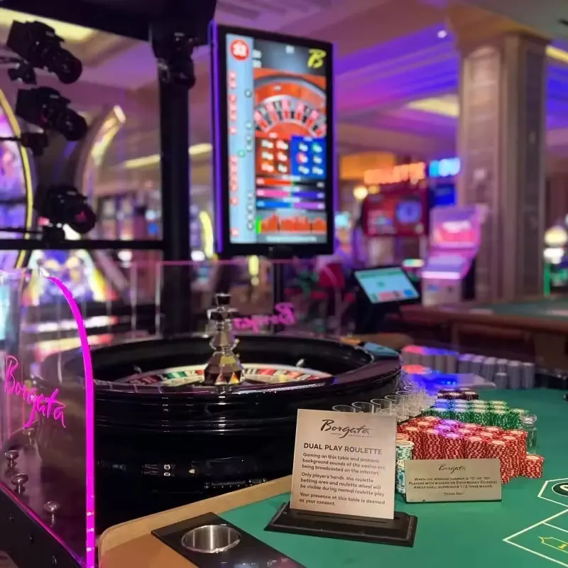 Realistic dealer in glamorous attire positioned beside a luminous roulette wheel with an inviting gesture against a radiant casino backdrop, photorealistic rendering