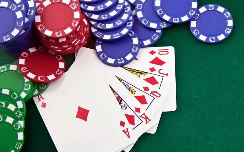 Confident dealer in sharp attire positioned at illuminated roulette table, surrounded by luxurious casino ambiance and dramatic lighting, photorealistic style